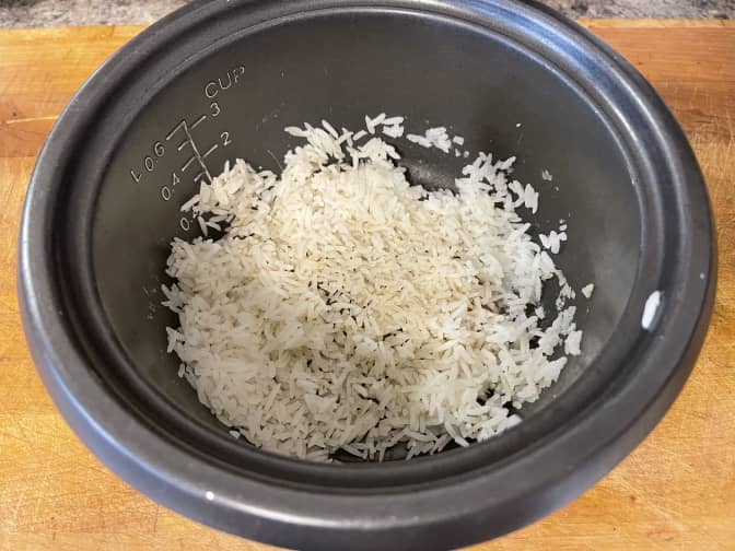 Image of a rice cooker with stuck on rice.