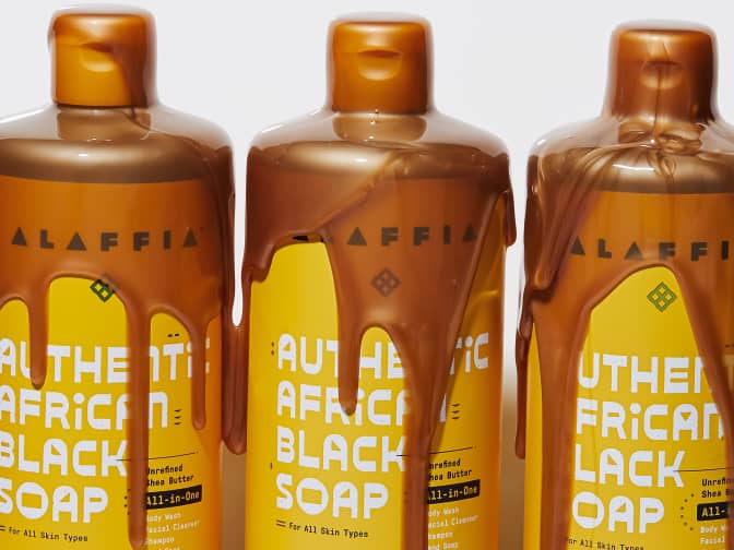 Image of Alaffia African Black Soap bottles with soap dripping out of the top