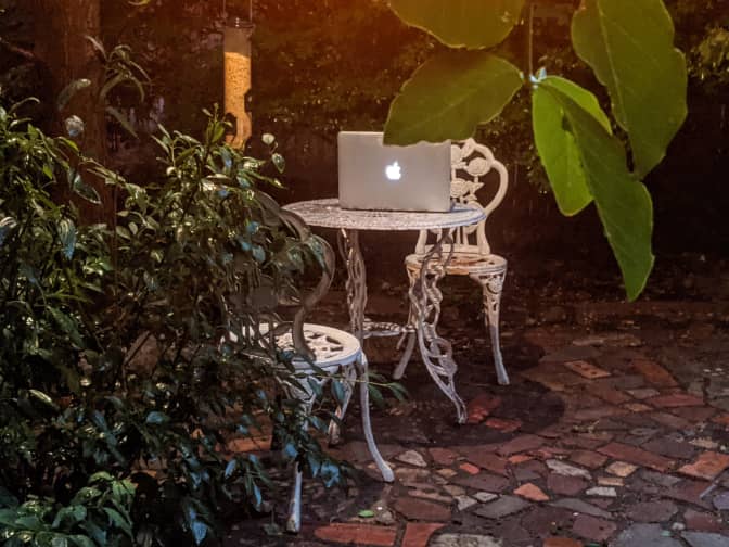 Photo of outdoor table with laptop on it