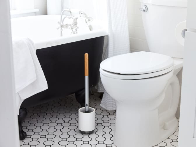 Image of a toilet and a toilet brush
