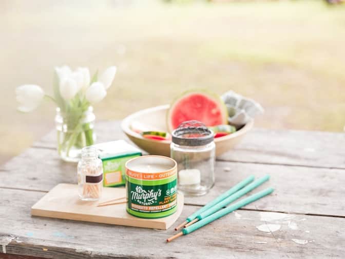 Murphy’s naturals mosquito candle and repellent incense sticks on a picnic table
