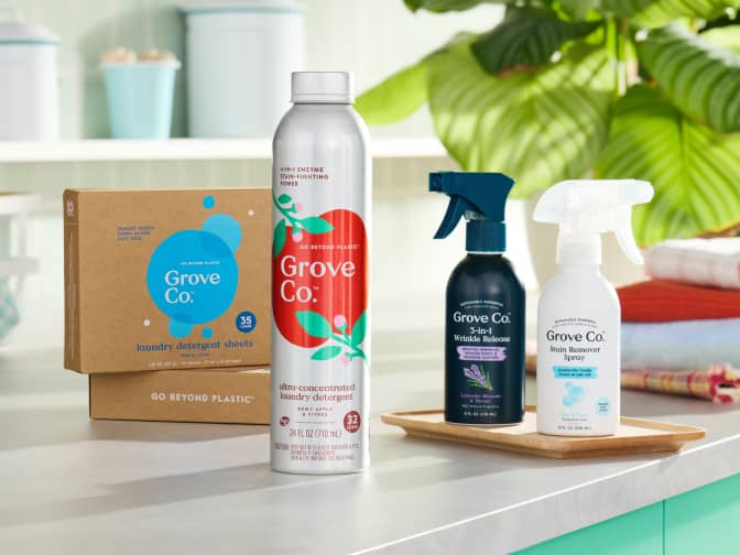 Laundry sheet held above an open dryer