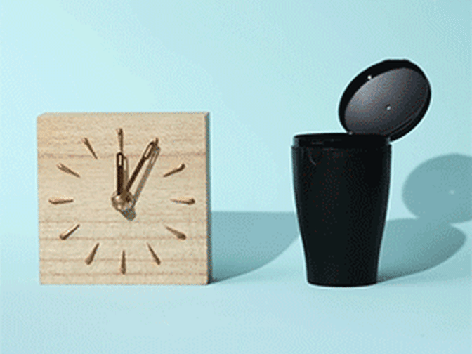 Gif of clock and next to it, liquid being poured into black cup and then clear menstrual cup being put inside black cup with liquid 