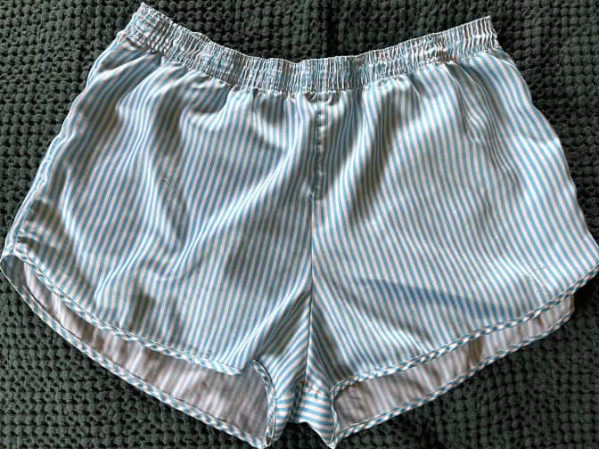 a pair of satin shorts after being laundry stripped.