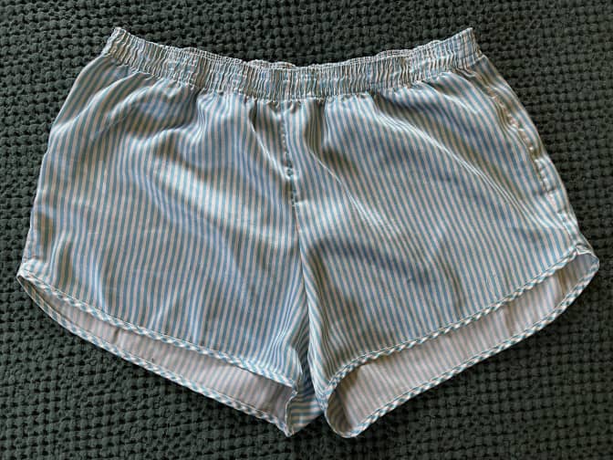 a pair of satin shorts before being laundry stripped.