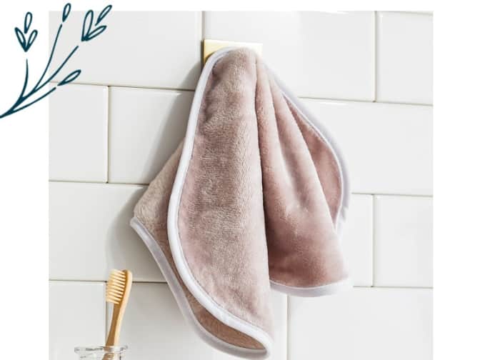 Photo of makeup remover towel hanging on bathroom hook