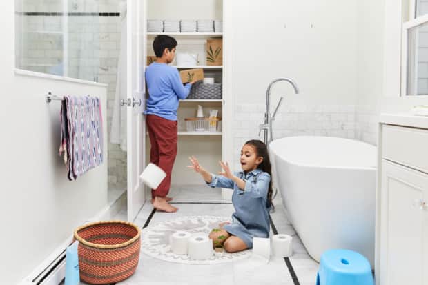 Image of two kids playing in the bathroom
